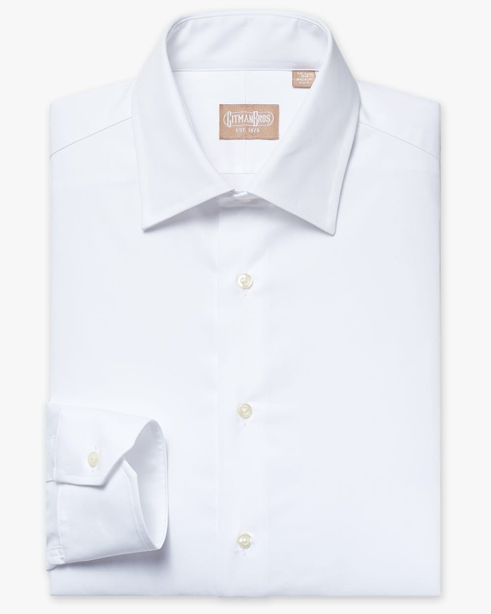 Folded button down shirt with white buttons and white fabric