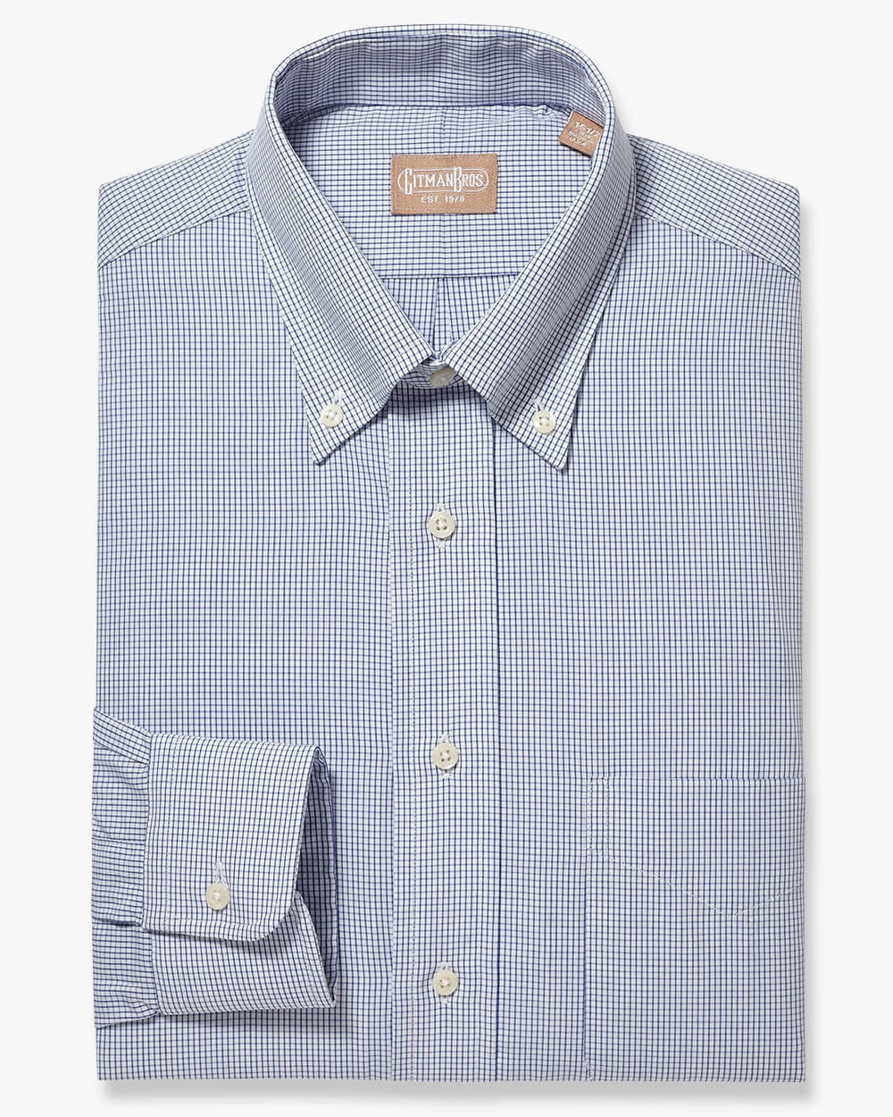 Folded button down shirt with white buttons and a navy and white check fabric