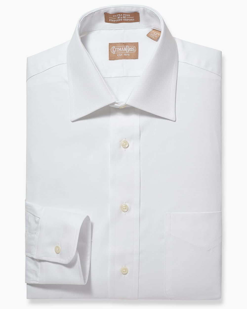 Folded button down shirt with white buttons and white fabric