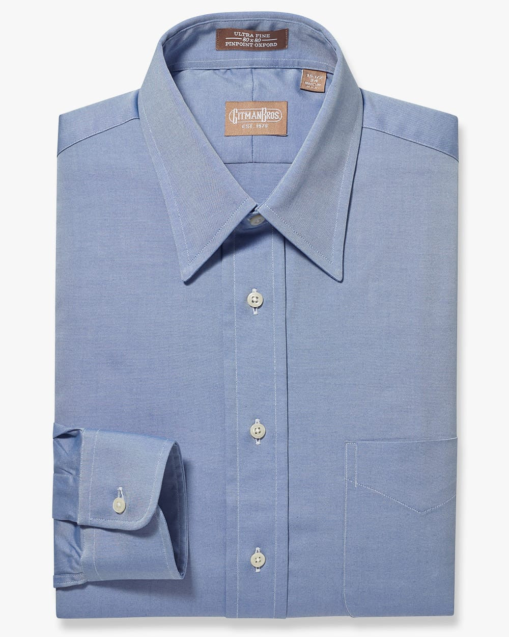 Folded button down shirt with white buttons and blue fabric