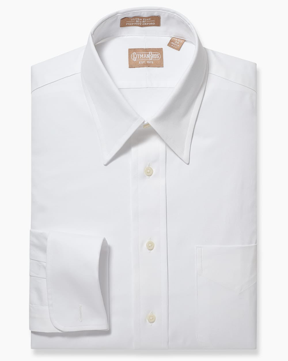 Folded button down with white buttons and white fabric and a french cuff
