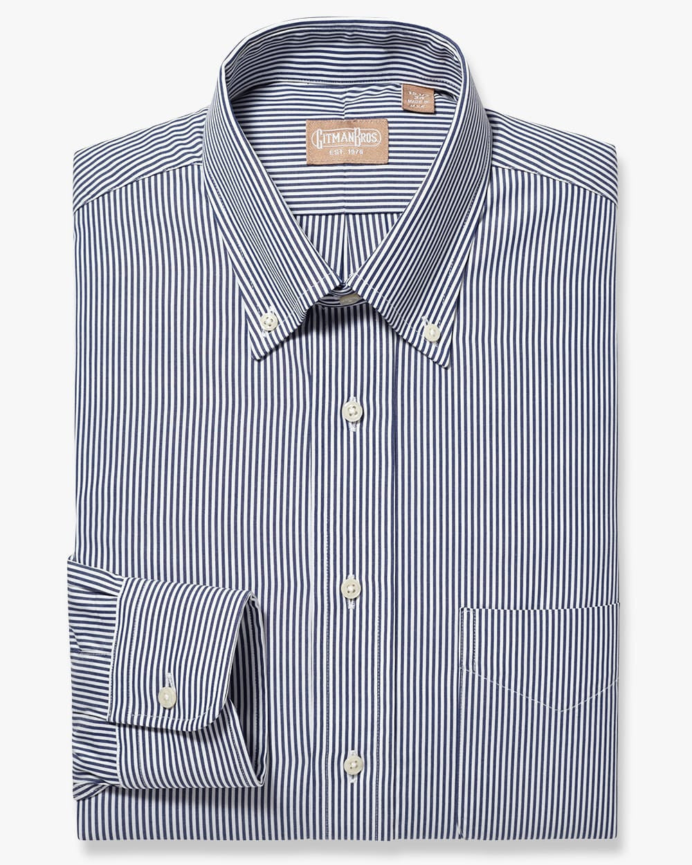 Folded button down with white buttons and navy and white vertical striped fabric