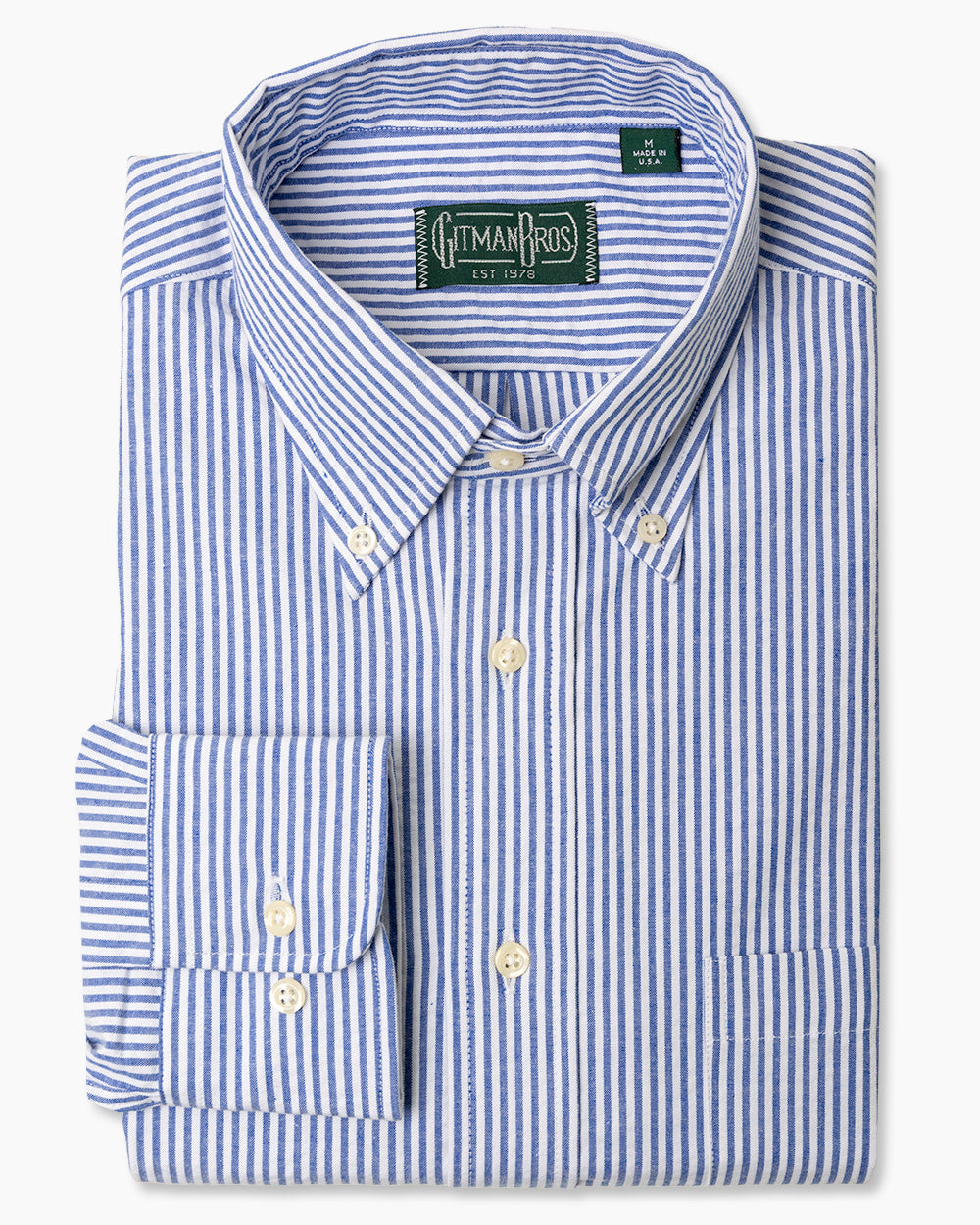 The Blue Stripe Seersucker sport shirt, with a button down collar and adjustable cuffs with white buttons on them.