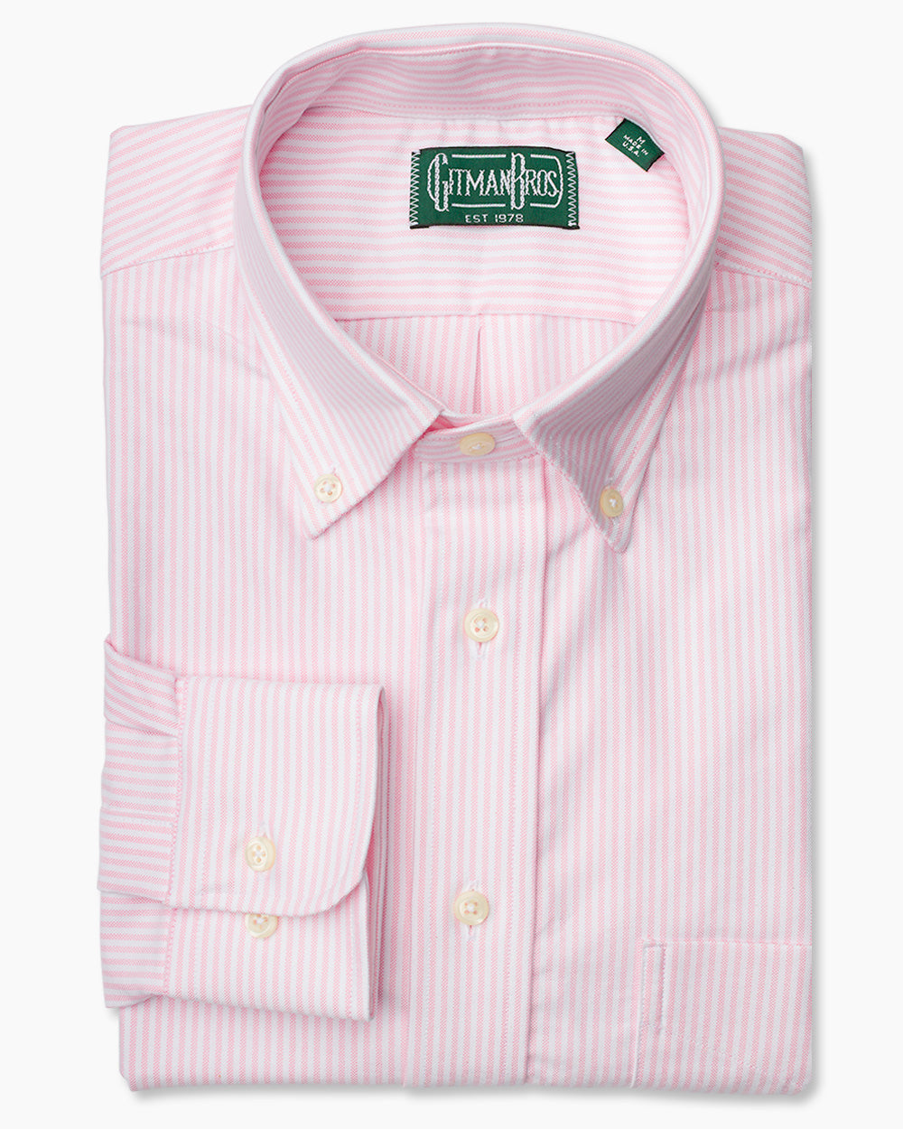The Pink Stripe Oxford shirt with a button down collar and white buttons on a stitched placket.