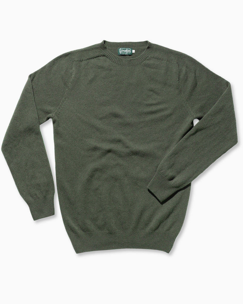 The Olive Merino/Cashmere Crewneck Sweater is made in Scotland from 90% merino wool and 10% cashmere. Seamless circular knitting and a softly brushed surface create a refined, exceptionally soft sweater with a clean, luxurious finish.
