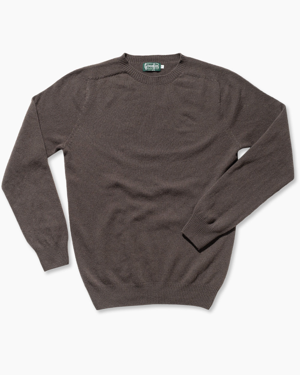 The Brown Merino/Cashmere Crewneck Sweater is made in Scotland from 90% merino wool and 10% cashmere. Seamless circular knitting and a softly brushed surface create a refined, exceptionally soft sweater with a clean, luxurious finish.