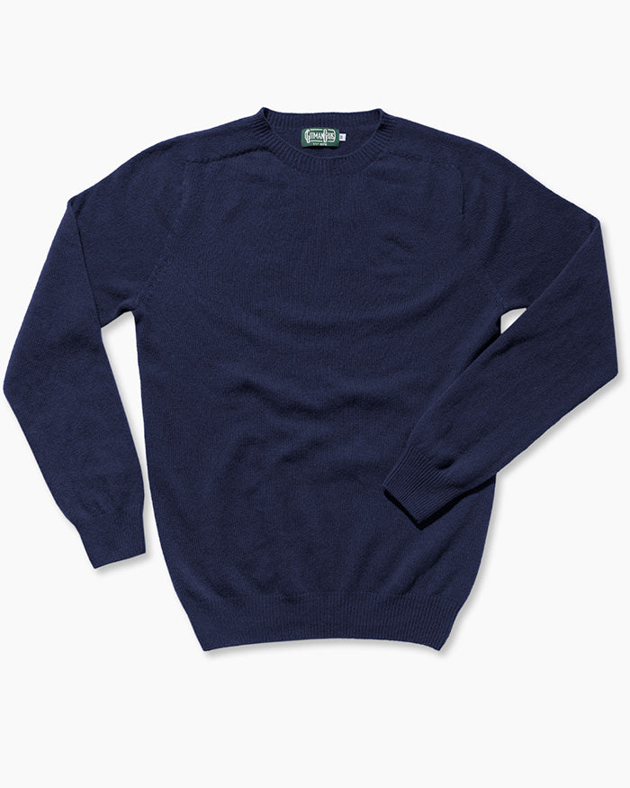 The Navy Merino/Cashmere Crewneck Sweater is made in Scotland from 90% merino wool and 10% cashmere. Seamless circular knitting and a softly brushed surface create a refined, exceptionally soft sweater with a clean, luxurious finish.