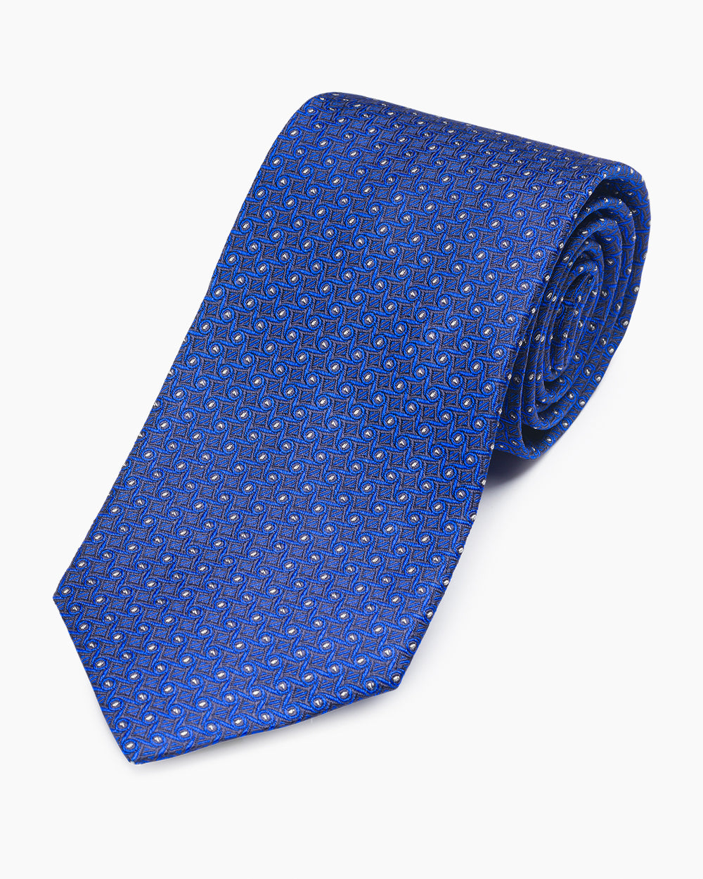 The Navy Woven Wave Tie, crafted from 100% silk and hand-sewn in North Carolina. A subtle textured pattern with a natural drape, designed for versatile, refined tailoring.