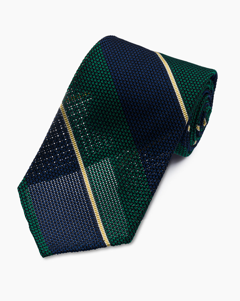 The Green University Stripe Grenadine Tie features a classic striped pattern and textured weave, handmade in North Carolina.